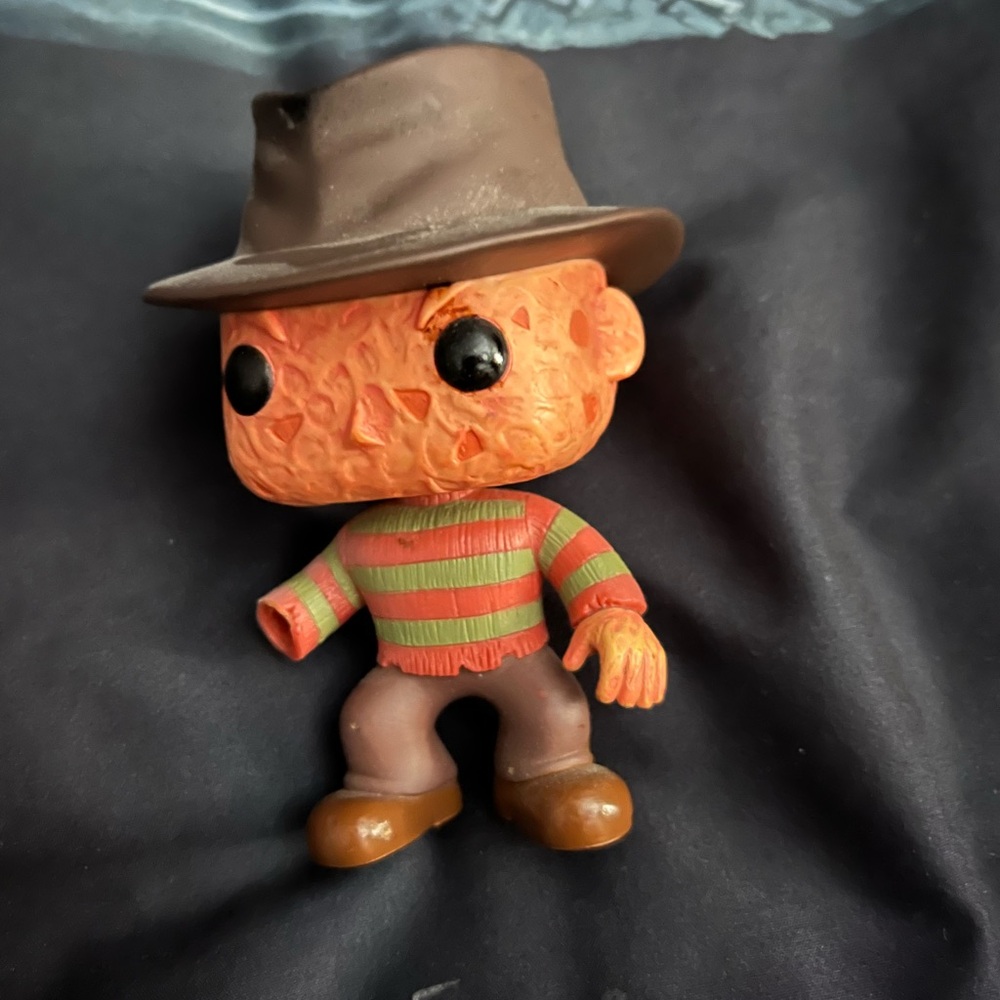 Funko Horror Figure with Brown Hat and Striped Sweater